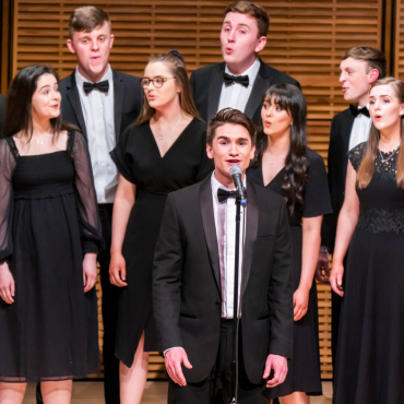 An image of students singing choral music